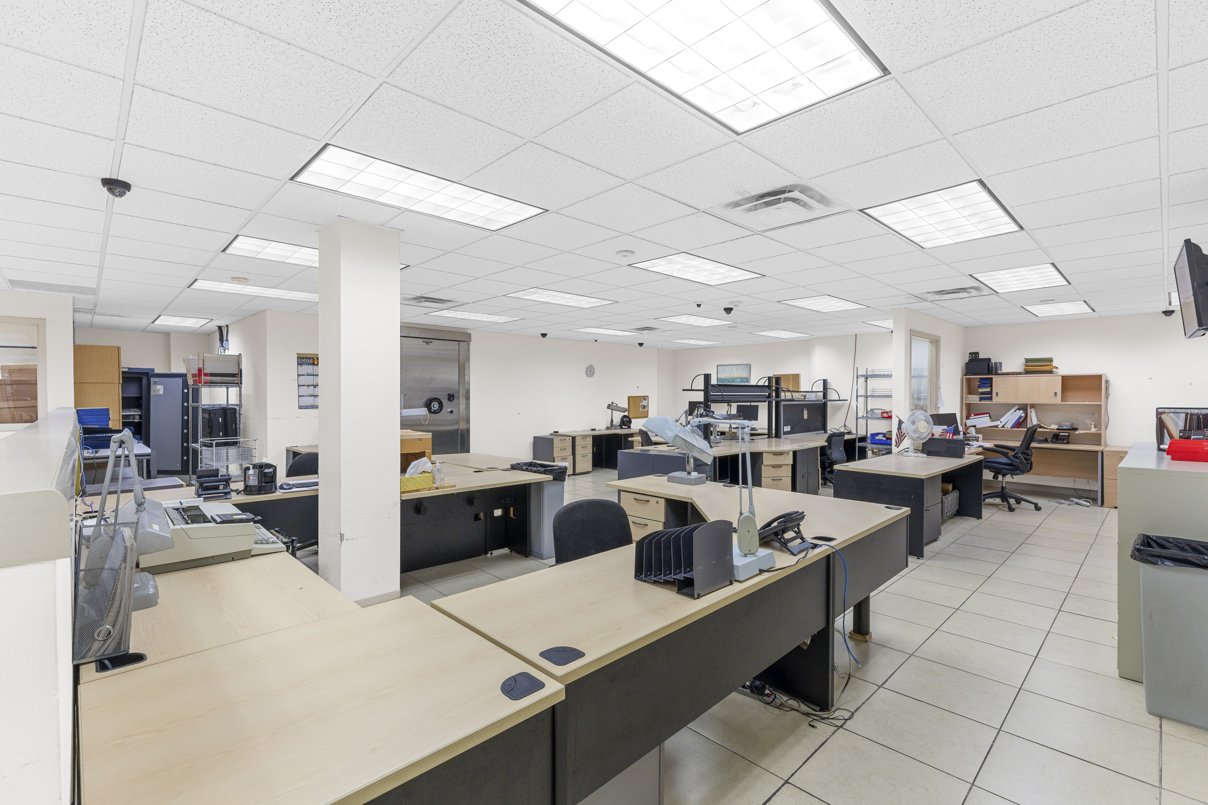Open office bullpen with vault