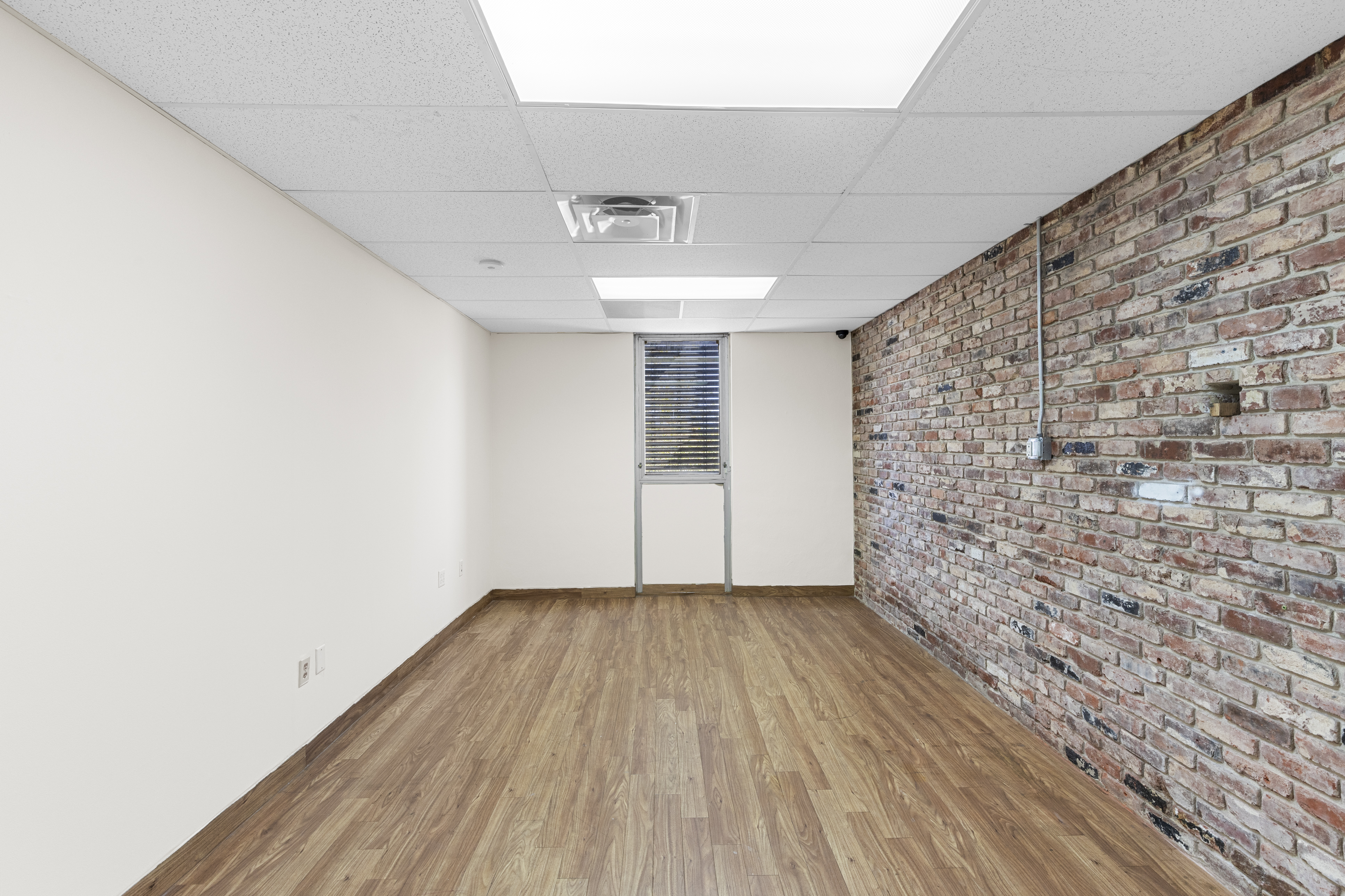 Office with exposed brick wall
