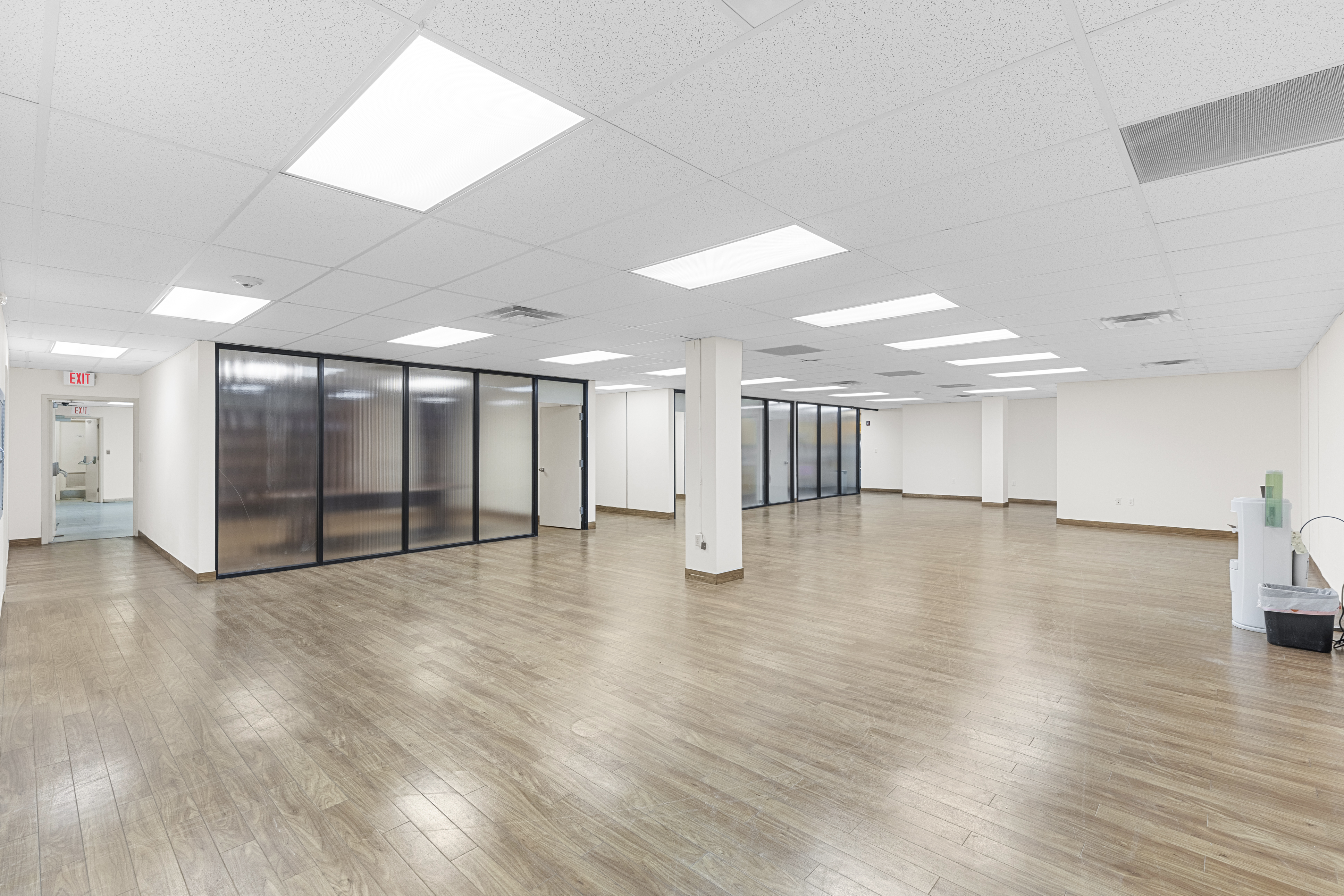 Open floor plan with glass offices